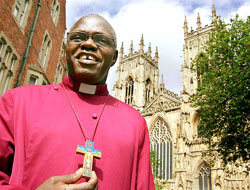 Dr John Sentamu, Archbishop of York, in front of York Minster