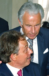Lord Levy leans over Tony Blair