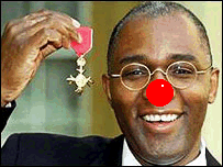 ’Sir’ Trevor Phillips shows off his medal from Whitey