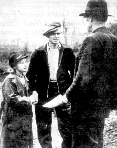 Charlie Johns, 22 and his bride, Eunice Winstead, 9, being married.