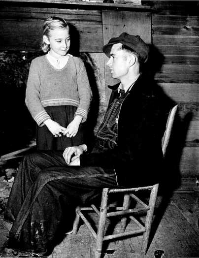 Charlie Johns, 22 and his wife Eunice, 9, at home.